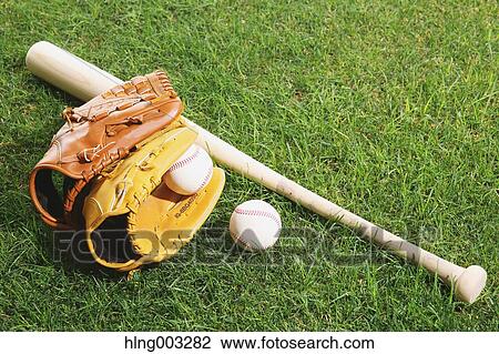 Baseball equipment on grass View Large Photo Image Stock Image - Baseball equipment on grass. Fotosearch