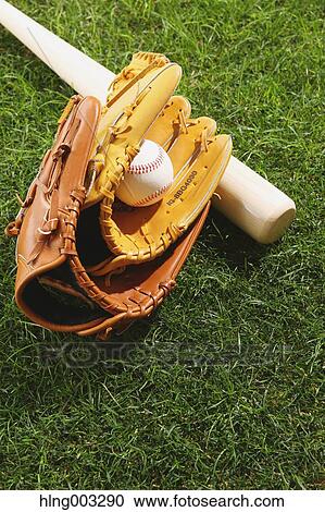 Baseball equipment on grass View Large Photo Image Stock Image - Baseball equipment on grass. Fotosearch