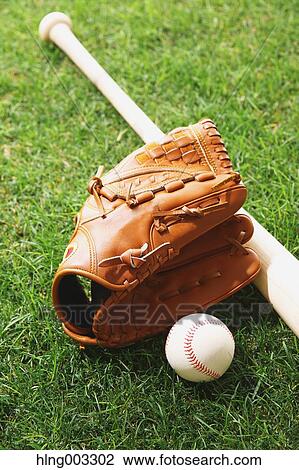 Baseball equipment on grass View Large Photo Image Stock Image - Baseball equipment on grass. Fotosearch