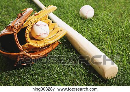Baseball equipment on grass View Large Photo Image Stock Photo - Baseball equipment on grass. Fotosearch