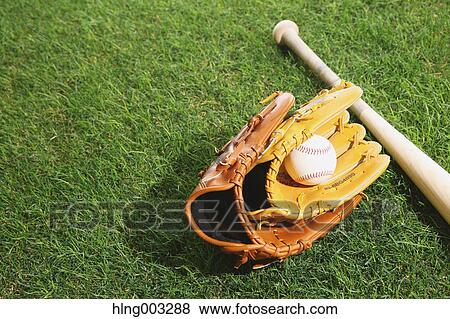 Baseball equipment on grass View Large Photo Image Stock Photo - Baseball equipment on grass. Fotosearch