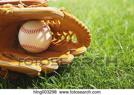 Baseball equipment on grass View Large Photo Image Stock Photo - Baseball equipment on grass. Fotosearch