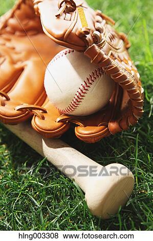 Baseball equipment on grass View Large Photo Image Stock Photo - Baseball equipment on grass. Fotosearch
