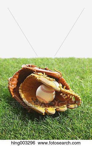 Baseball equipment on grass View Large Photo Image Stock Photograph - Baseball equipment on grass. Fotosearch