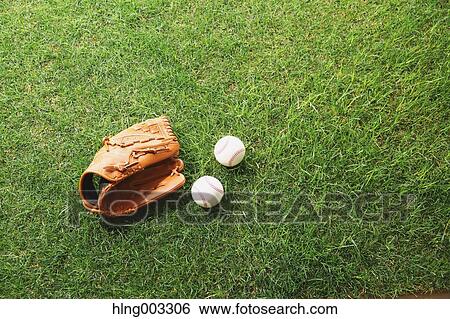 Baseball equipment on grass View Large Photo Image Stock Photograph - Baseball equipment on grass. Fotosearch
