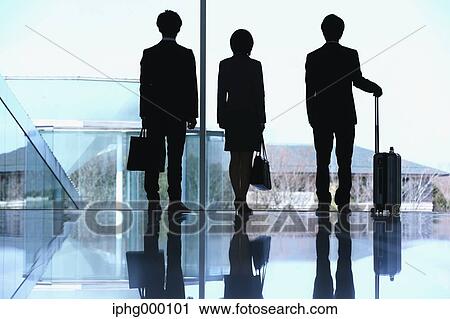 Stock Image - Business people at the airport. Fotosearch