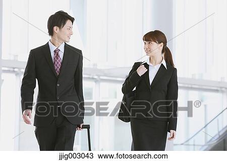 Stock Image - Business people at the airport. Fotosearch
