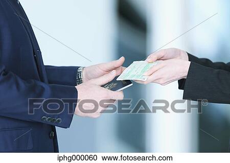 Business people exchanging business cards View Large Photo Image Stock Image - Business people exchanging business cards. Fotosearch