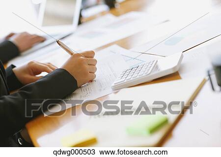 Stock Image - Business people having a meeting. Fotosearch