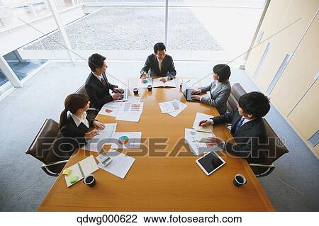 Stock Image - Business people having a meeting. Fotosearch