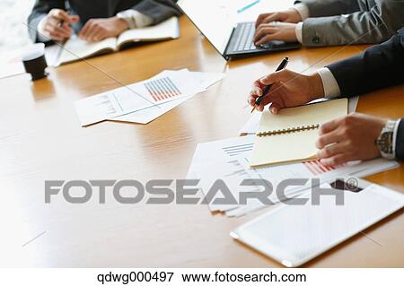 Business people having a meeting View Large Photo Image Stock Photo - Business people having a meeting. Fotosearch