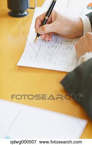 Stock Photo - Business people having a meeting. Fotosearch