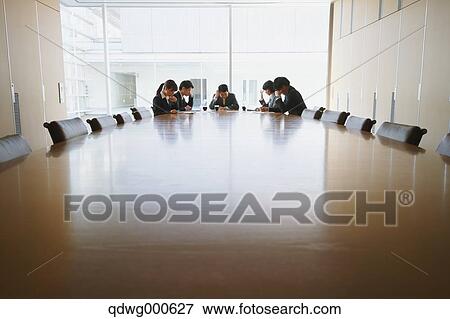 Stock Photo - Business people having a meeting. Fotosearch