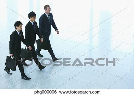 Stock Photograph - Businessmen at the airport. Fotosearch