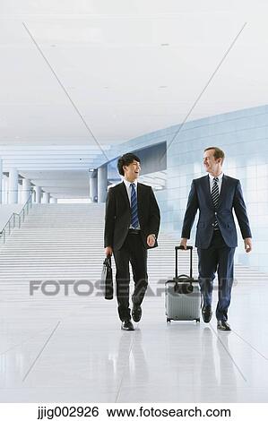 Stock Photograph - Businessmen at the airport. Fotosearch