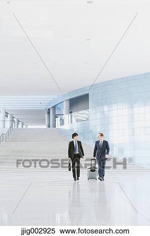 Businessmen at the airport View Large Photo Image Stock Photography - Businessmen at the airport. Fotosearch
