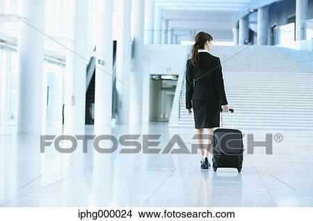 Businesswoman at the airport View Large Photo Image Picture - Businesswoman at the airport. Fotosearch