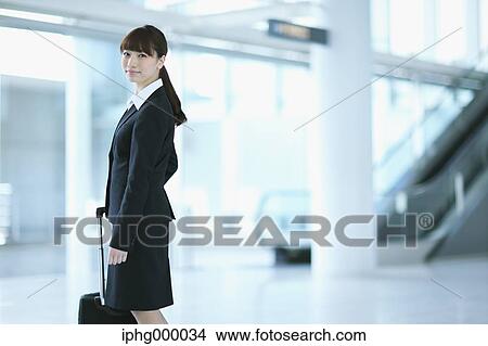 Businesswoman at the airport View Large Photo Image Picture - Businesswoman at the airport. Fotosearch