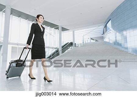 Picture - Businesswoman at the airport. Fotosearch
