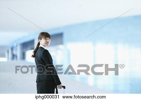 Businesswoman at the airport View Large Photo Image Stock Image - Businesswoman at the airport. Fotosearch