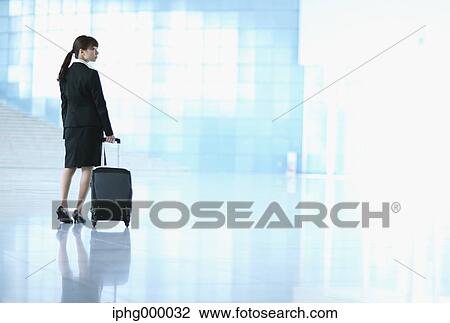 Businesswoman at the airport View Large Photo Image Stock Image - Businesswoman at the airport. Fotosearch