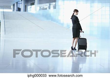 Businesswoman at the airport View Large Photo Image Stock Image - Businesswoman at the airport. Fotosearch