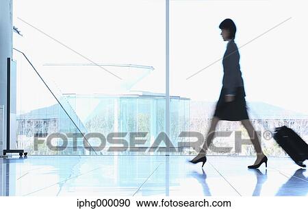 Businesswoman at the airport View Large Photo Image Stock Image - Businesswoman at the airport. Fotosearch