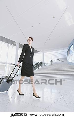 Businesswoman at the airport View Large Photo Image Stock Image - Businesswoman at the airport. Fotosearch