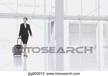 Businesswoman at the airport View Large Photo Image Stock Image - Businesswoman at the airport. Fotosearch