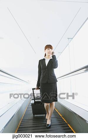 Businesswoman at the airport View Large Photo Image Stock Image - Businesswoman at the airport. Fotosearch