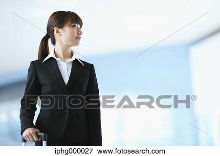 Businesswoman at the airport View Large Photo Image Stock Photo - Businesswoman at the airport. Fotosearch