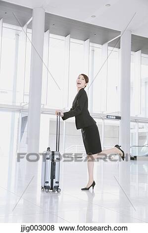 Businesswoman at the airport View Large Photo Image Stock Photo - Businesswoman at the airport. Fotosearch
