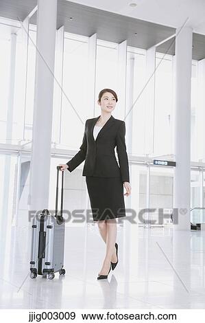 Businesswoman at the airport View Large Photo Image Stock Photo - Businesswoman at the airport. Fotosearch