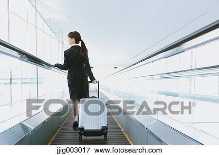 Businesswoman at the airport View Large Photo Image Stock Photo - Businesswoman at the airport. Fotosearch