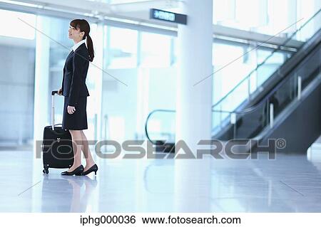 Businesswoman at the airport View Large Photo Image Stock Photograph - Businesswoman at the airport. Fotosearch
