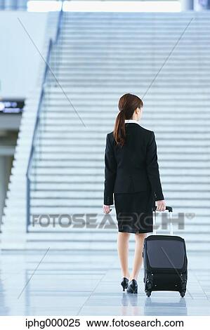 Businesswoman at the airport View Large Photo Image Stock Photography - Businesswoman at the airport. Fotosearch