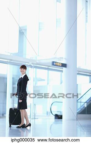 Businesswoman at the airport View Large Photo Image Stock Photography - Businesswoman at the airport. Fotosearch