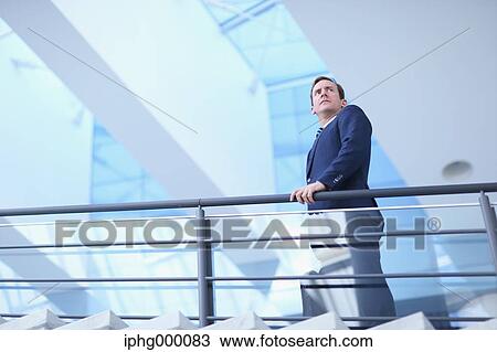 Caucasian businessman in modern office View Large Photo Image Stock Image - Caucasian businessman in modern office. Fotosearch