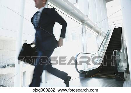 Stock Image - Caucasian businessman in modern office. Fotosearch
