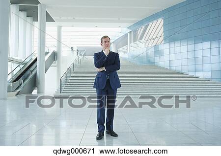 Caucasian businessman in modern office View Large Photo Image Stock Image - Caucasian businessman in modern office. Fotosearch