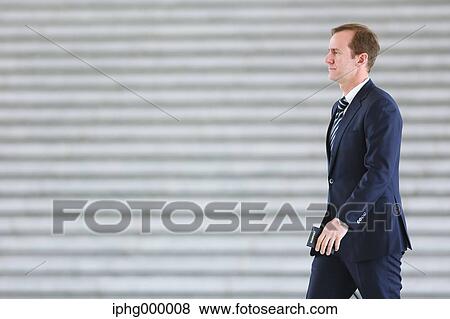 Stock Photo - Caucasian businessman in modern office. Fotosearch