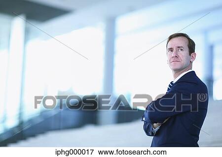 Stock Photo - Caucasian businessman in modern office. Fotosearch