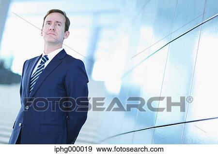 Caucasian businessman in modern office View Large Photo Image Stock Photo - Caucasian businessman in modern office. Fotosearch