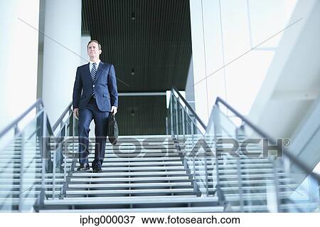 Stock Photo - Caucasian businessman in modern office. Fotosearch