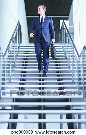 Caucasian businessman in modern office View Large Photo Image Stock Photo - Caucasian businessman in modern office. Fotosearch