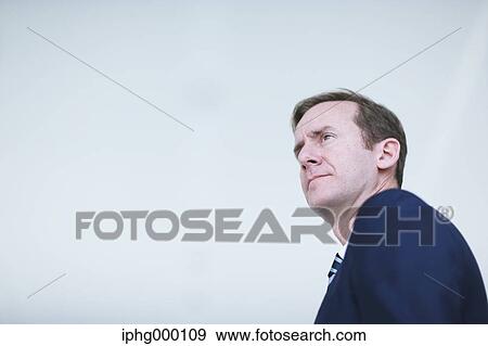 Caucasian businessman in modern office View Large Photo Image Stock Photo - Caucasian businessman in modern office. Fotosearch
