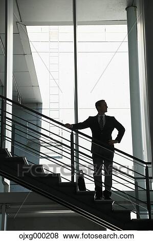 Caucasian businessman in modern office View Large Photo Image Stock Photo - Caucasian businessman in modern office. Fotosearch
