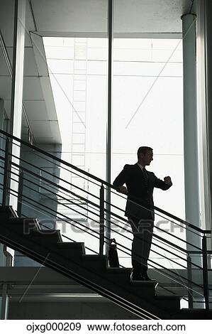 Caucasian businessman in modern office View Large Photo Image Stock Photo - Caucasian businessman in modern office. Fotosearch
