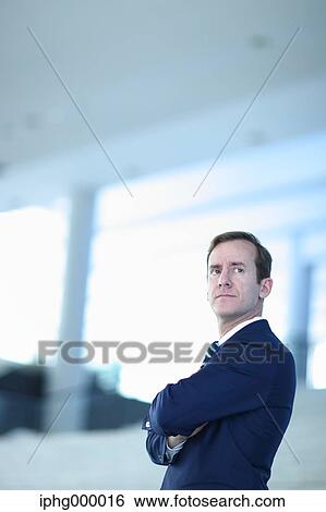 Caucasian businessman in modern office View Large Photo Image Stock Photograph - Caucasian businessman in modern office. Fotosearch