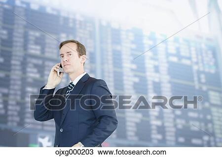 Caucasian businessman on the phone in modern office View Large Photo Image Stock Image - Caucasian businessman on the phone in modern office. Fotosearch